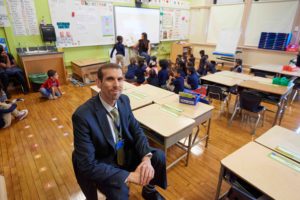 Southwark principal sitting in a classroom