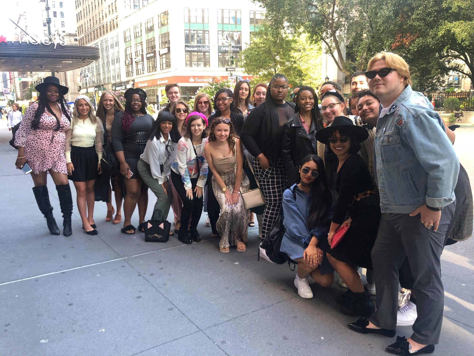 Group shot of fashion students in the NYC fashion immersion program.
