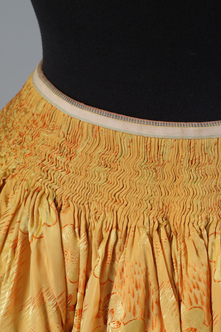 Detail of the cartridge pleats at the waist.