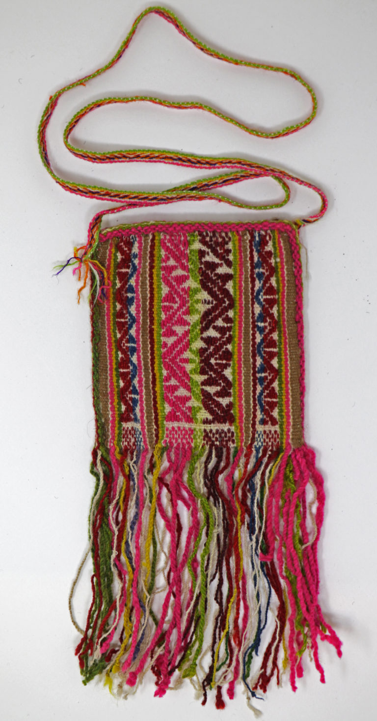 Multicolored coca bag with a radiating diamond motif and fringe. Peru. 20th century.