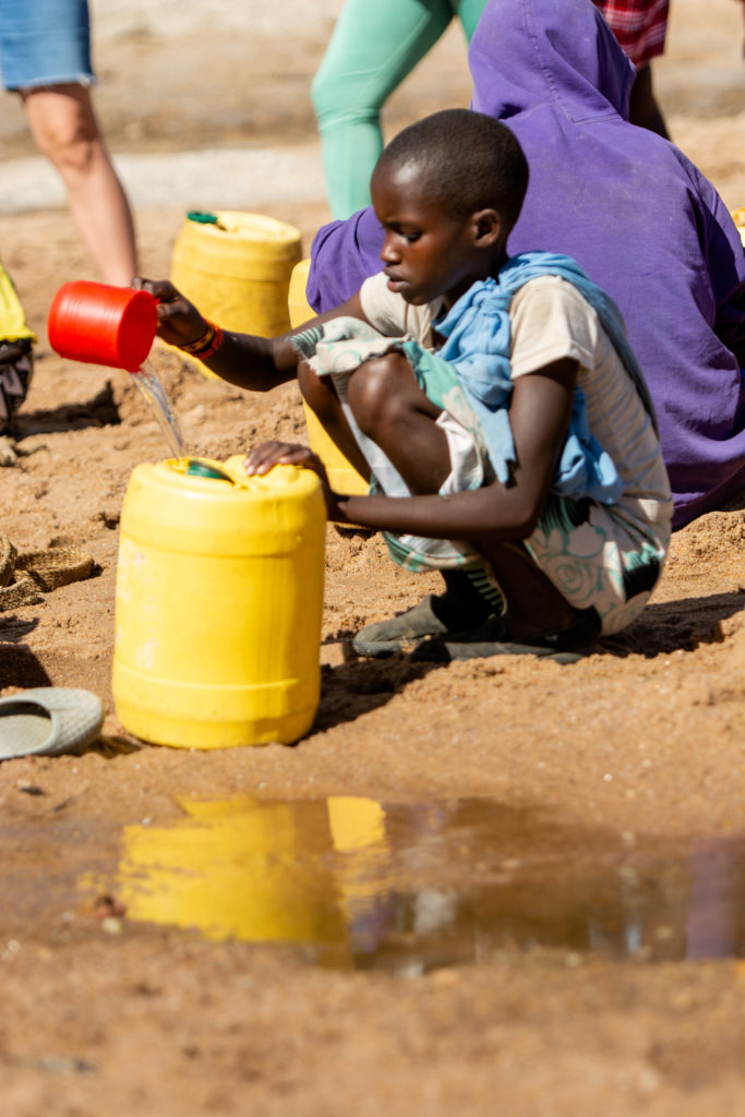 A child collecting water